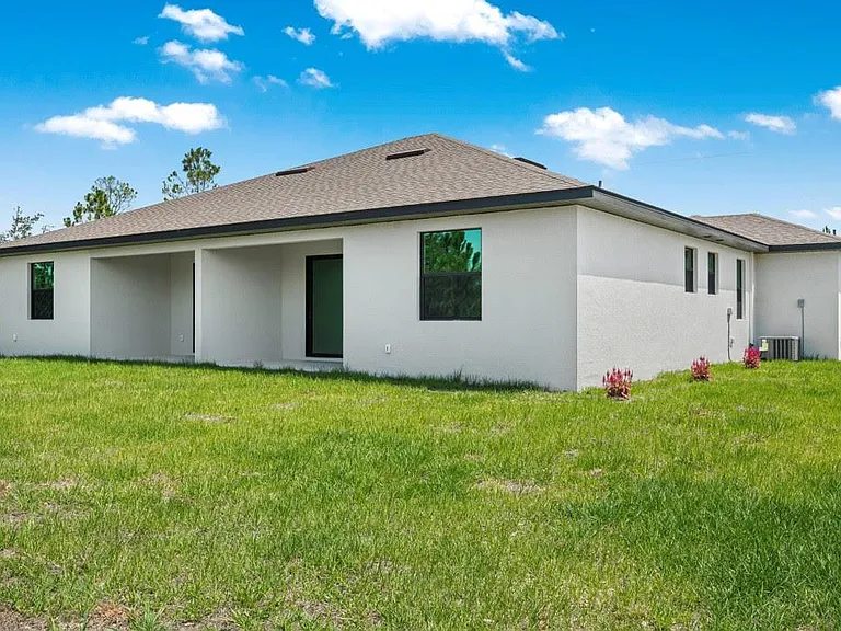 Rear of Duplex, private lanai for table, chairs and outdoor grilling