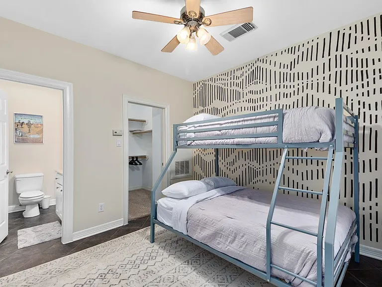 First floor bedroom with large closet and private bath