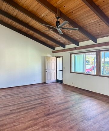 Living room area with vaulted ceilings