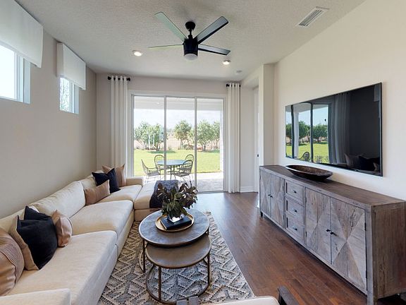 Model Representation Gathering room sliding glass door to extended screened-in patio
