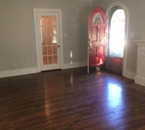 Entry area and glass paned door to extra room. Extra room also accessible from center bedroom. Tiled floor in extra room.