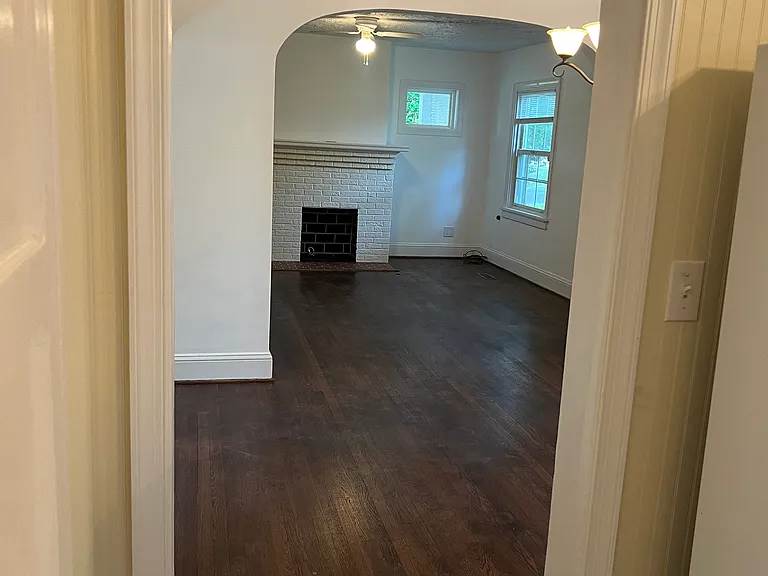 looking from kitchen, through dining room into living room