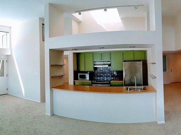 living room, kitchen area, entrance and first bedroom
