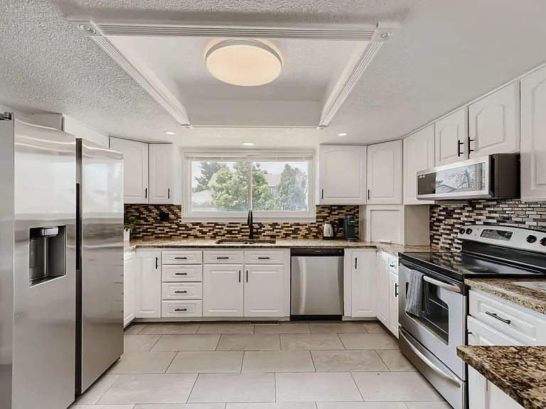 Fully outfitted kitchen to include microwave, Keurig, kettle, toaster, cookware, plates, glasses, mugs and utensils