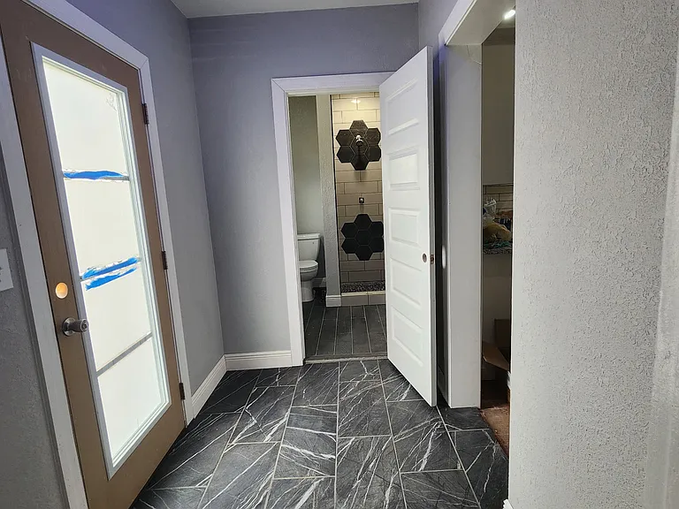 Back foyer with tile flooring - with smart lighting