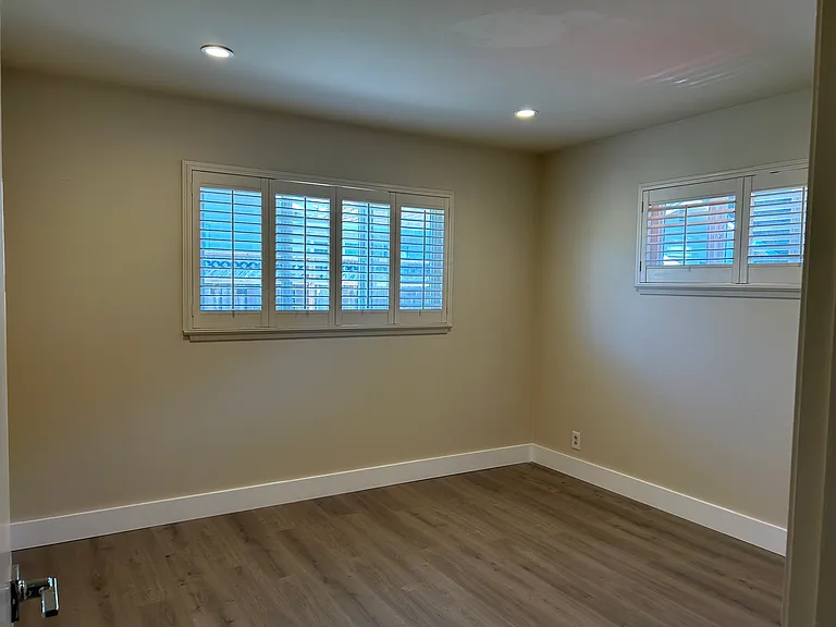 Second bedroom with plantation shutters