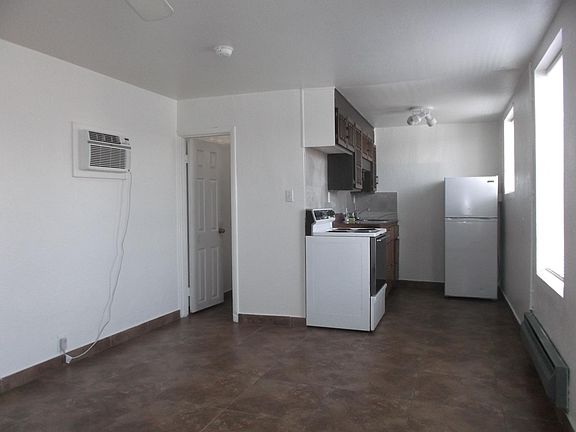 Living Area facing Kitchen and Bathroom