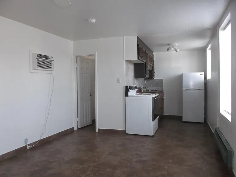 Living Area facing Kitchen and Bathroom