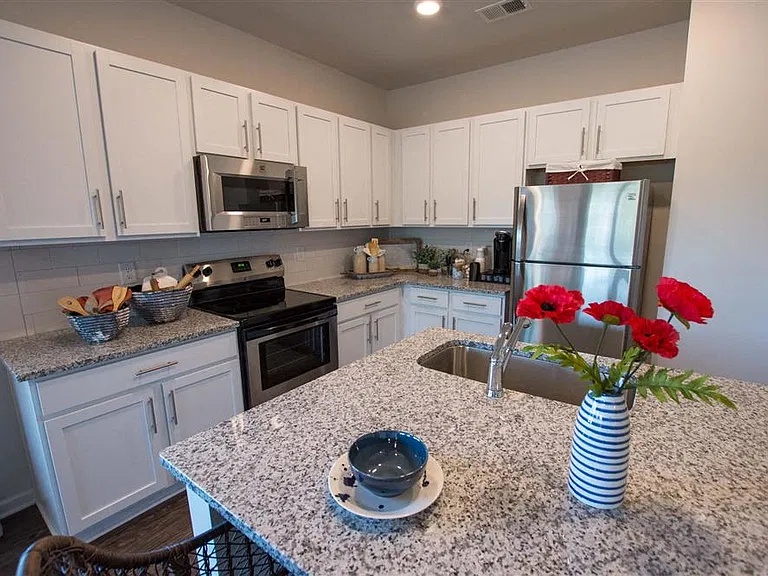 View of the kitchen and offering plenty of cabinet space and granite countertops.