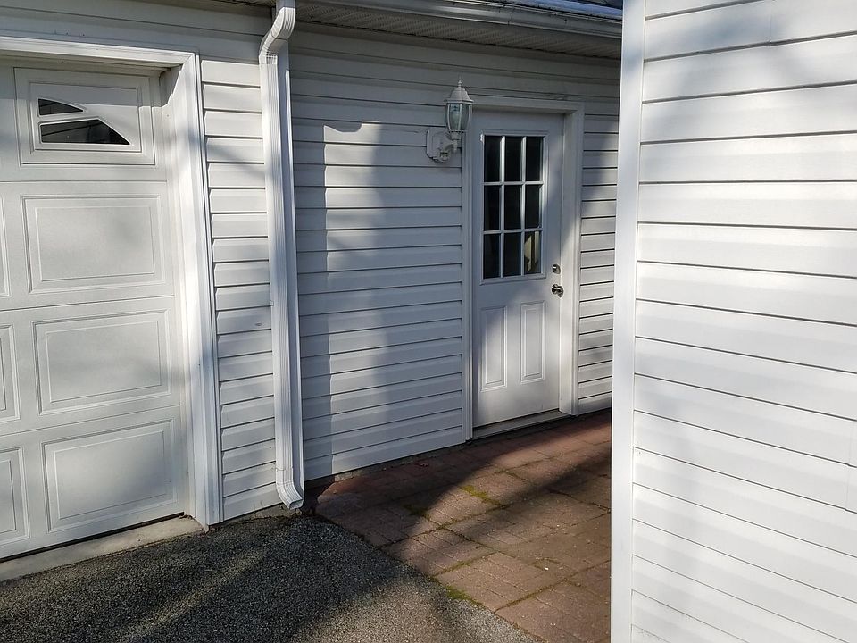 Exterior door to front of apartment through courtyard