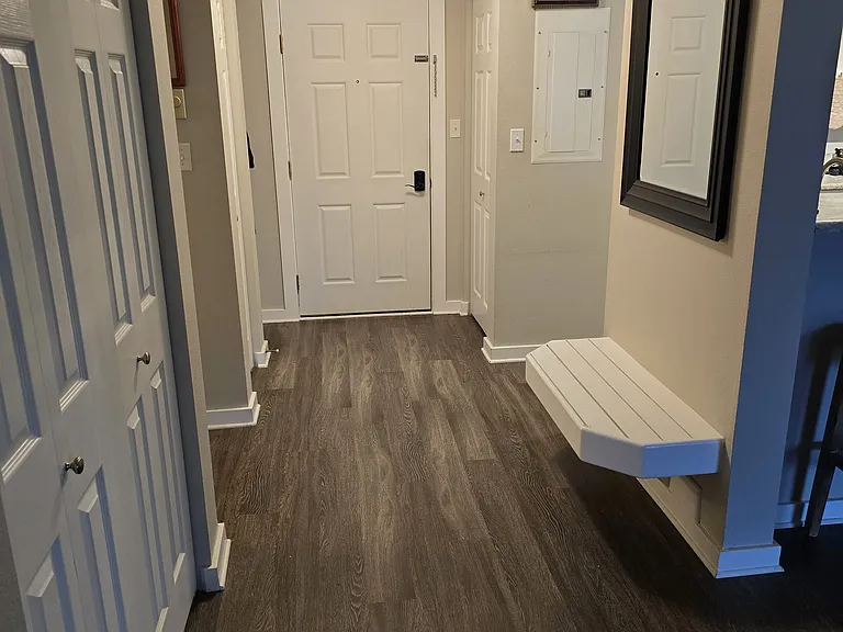 Entryway area with two closets and bench to take your boots and gear off