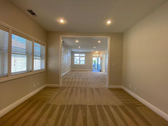 Dining room view into living room and street
