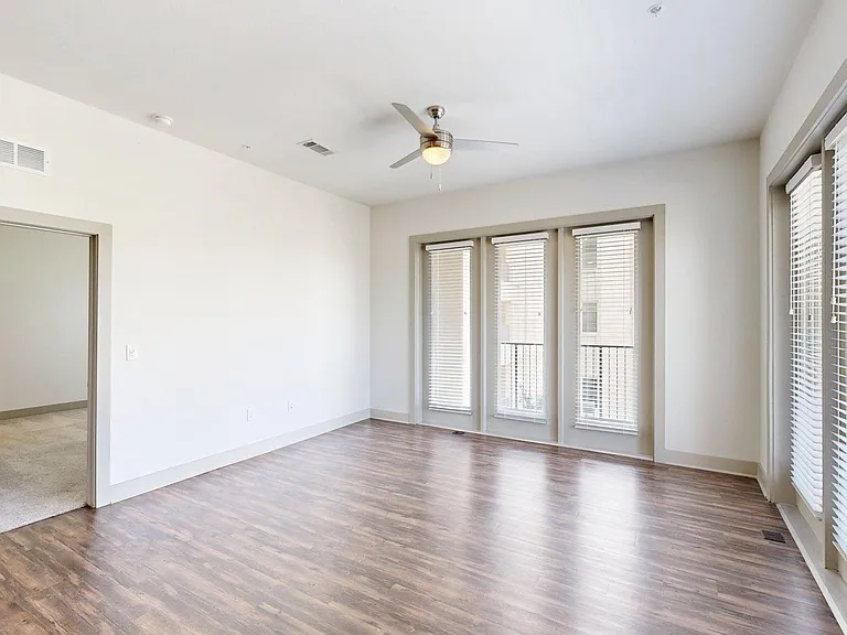 Apartment Living Room with Wood-Style Flooring and Patio/Balcony.