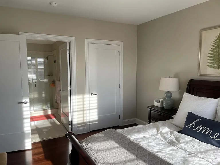 Bedroom with access to bathroom and walk in closet