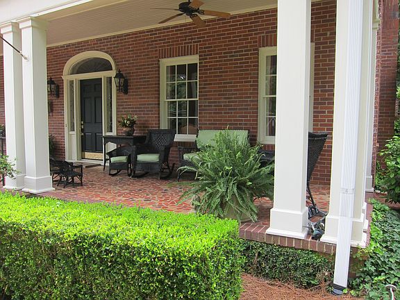 Cozy porch with ceiling fan
