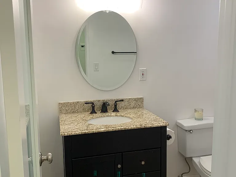 BEAUTIFUL NEW VANITY WITH NEW LIGHTING AND OIL RUBBED PLUMBING FIXTURES