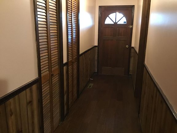 Front foyer with coat closet and a storage closet