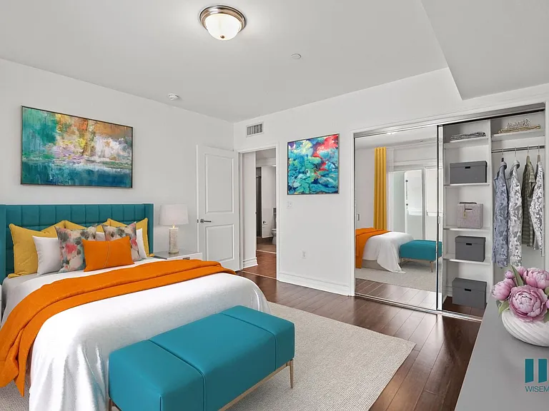 Bedroom with Vinyl Flooring, and Mirrored Closet with Shelving