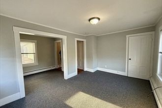 LIving room with bonus room ideal for office or extra dining area.