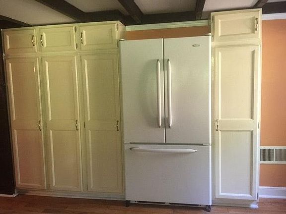 Full size family refrigerator showing some of pantry and sto