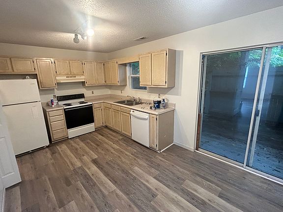 Kitchen with refrigerator, stove, and dishwasher