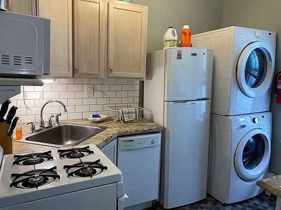 Full kitchen with dishwasher and washer/dryer