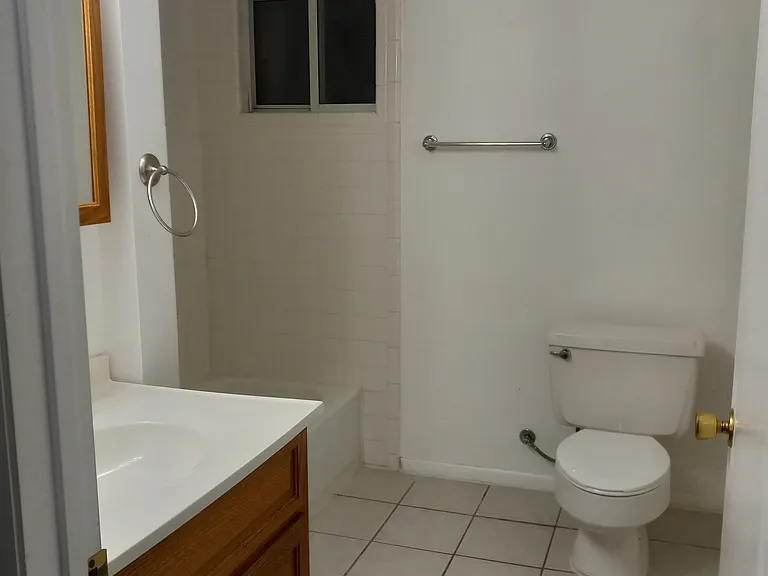 View #1 of full, spacious bathroom; accessible to all rooms in apartment.