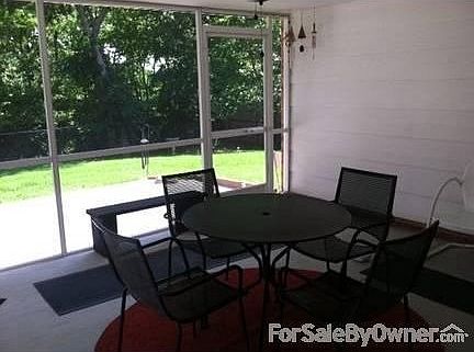 Back patio
						:
						Back yard to tree line / Paige Belcher golf behind tree line---very private