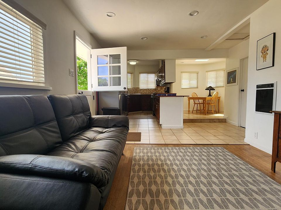This is the greatroom - open areas and cute with a living room, dining room, and kitchen