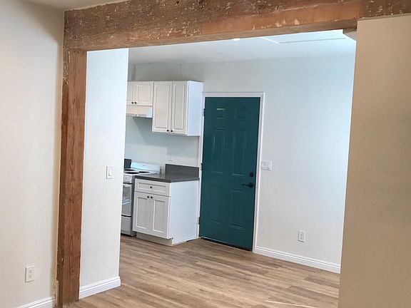 Living / dining area with exposed beam.