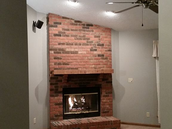 View of fireplace from entry