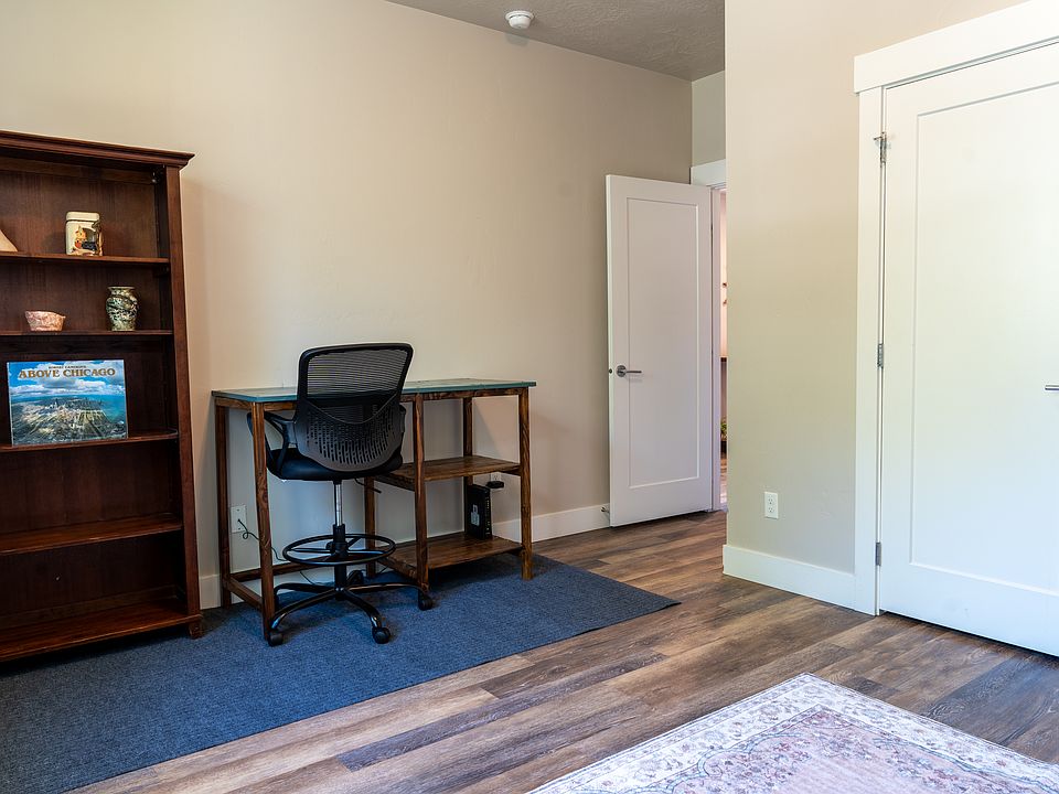 First floor bedroom, currently furnished as an office space with futon. Has a large closet.