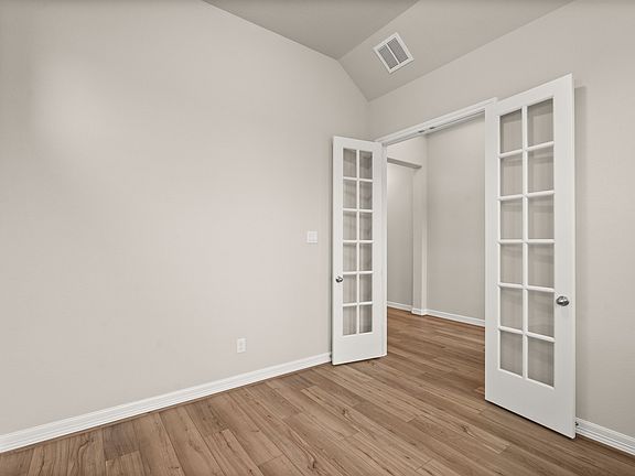 An additional view of the study with French doors.