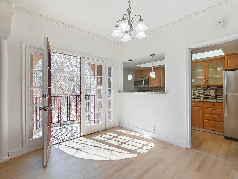 Dining Area Overlooking Kitchen + Balcony