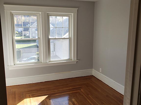 Second bedroom with hardwood floors.