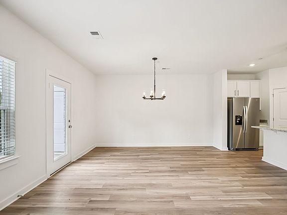 The open-concept floorplan allows for an easy flow between the kitchen and dining areas.