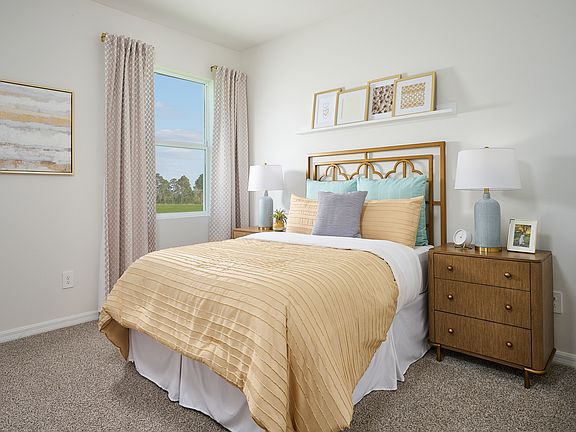The Bedroom of the Foxglove modeled at The Grove at Stuart Crossing.