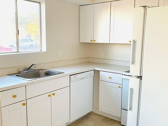 Kitchen with stove refrigerator dishwasher and microwave