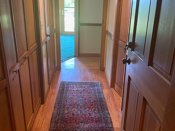 inside entrance hall with three closets