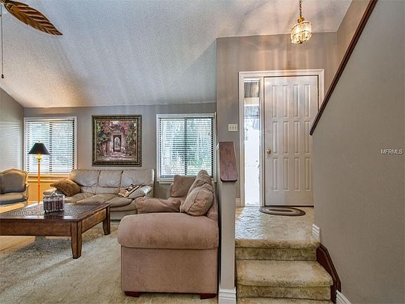Living room with wood burning fireplace