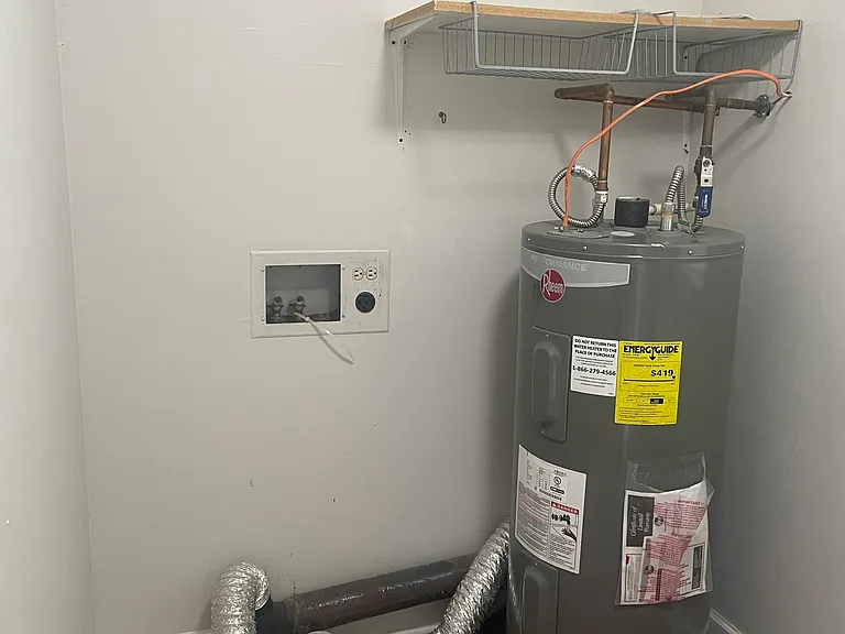 Utility area perfect for a stackable washer and dryer.