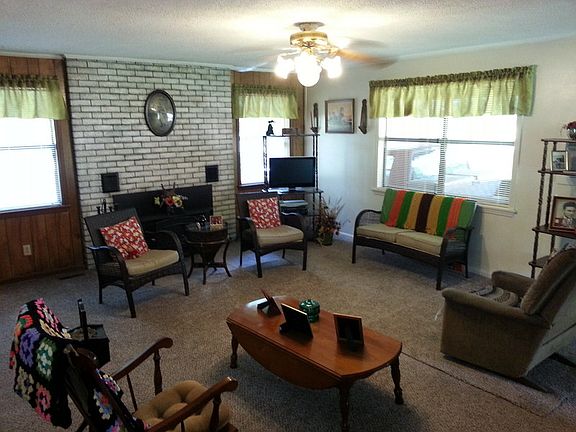 Living Room
						:
						Double-pane windows add plenty of light.