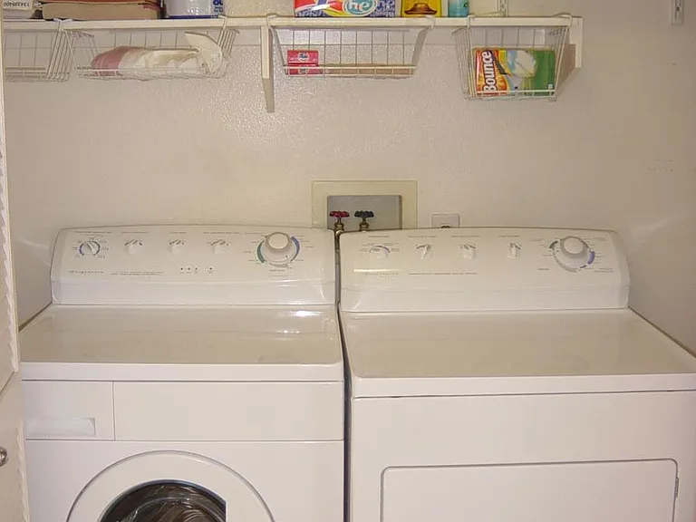 Full size front load washer and dryer in unit