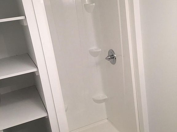 Bathroom with new stall shower and plenty of storage