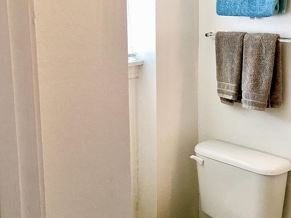 Upstairs full bath, with window. Light and bright.