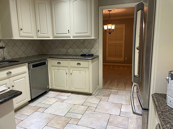 Kitchen looking into office/playroom