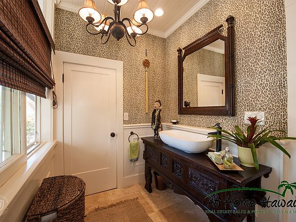 This charming bathroom on the first floor is conveniently located above the quirky basement bedroom.