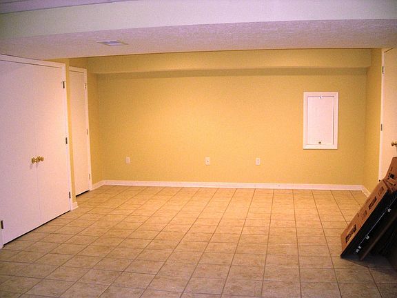 Game Room area of finished basement - tile floor, renovated 2009