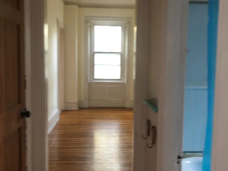 View from Hallway of Living room and bathroom