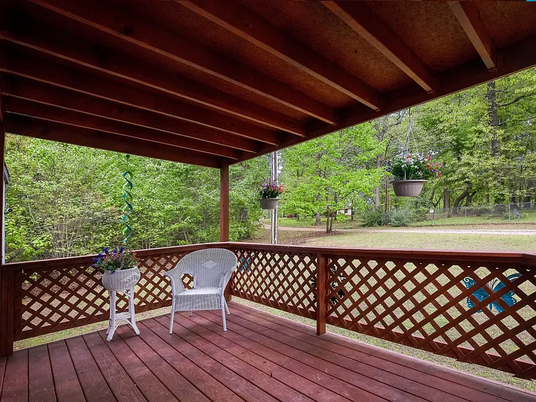 covered deck on front of house